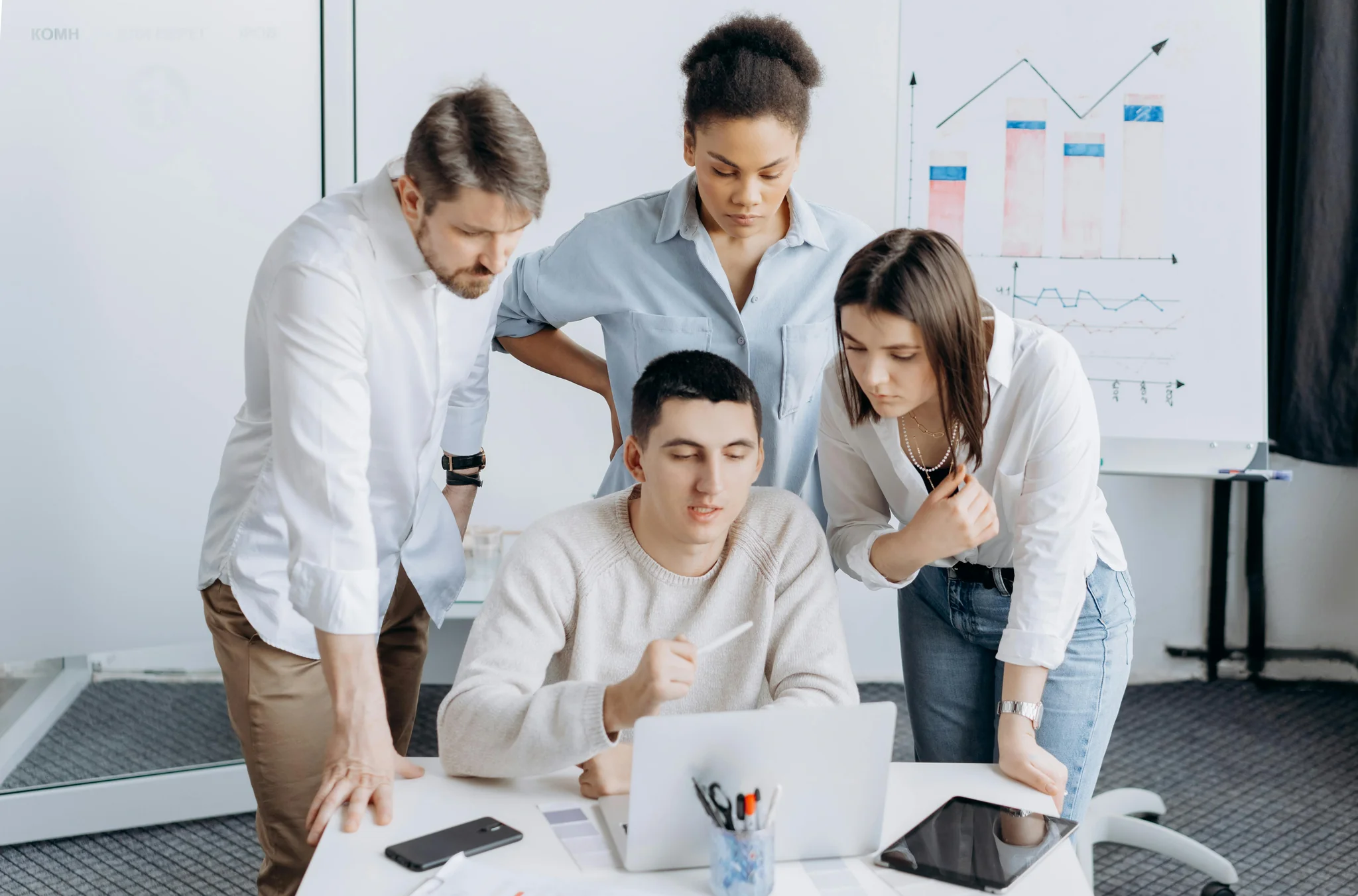 Digital marketing team reviewing strategy and analytics data